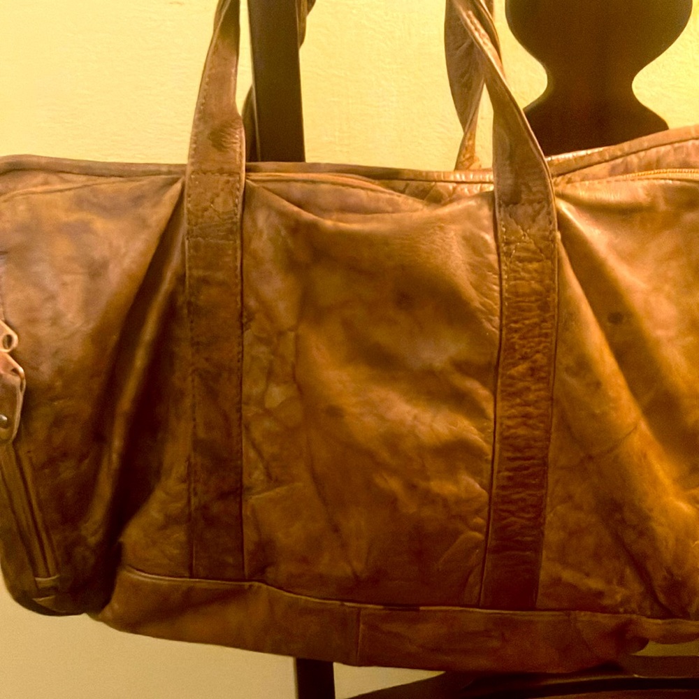 Wilson’s. tan 100% leather bag